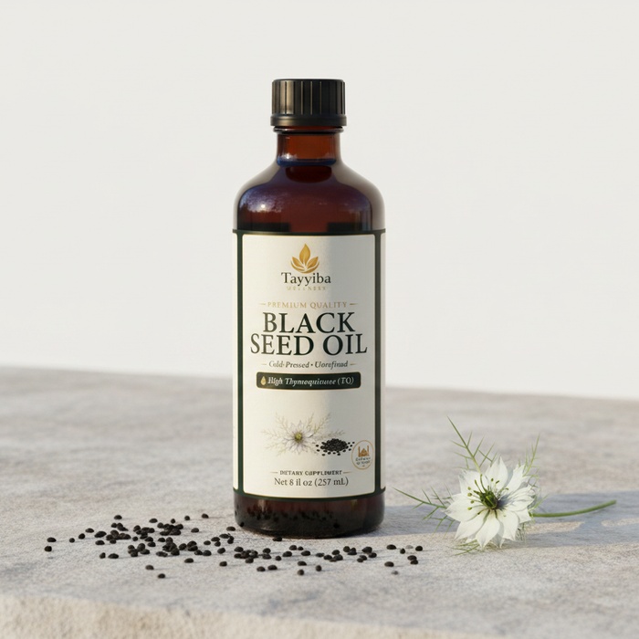 Tayyiba Wellness amber glass black seed oil bottle with nigella seeds